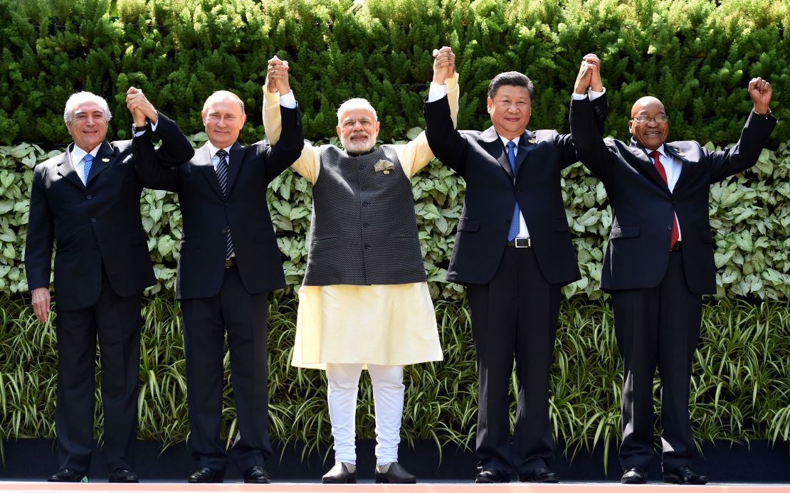  Brazilian President Michel Temer, Russian President Vladimir Putin, Indian Prime Minister Narendra Modi, Chinese President Xi Jinping and South African President Jacob Zuma pose for a group photo during the BRICS Summit in Goa.