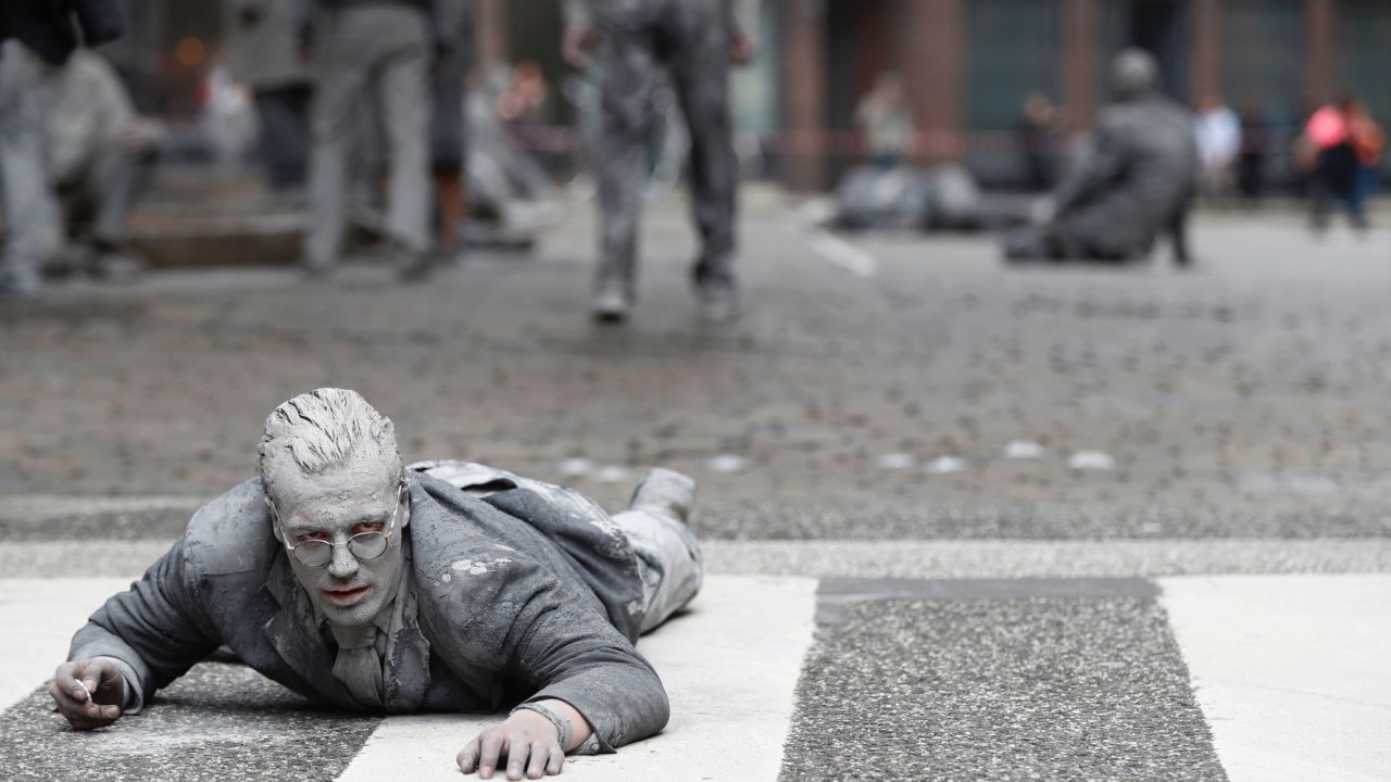 A performer smeared with clay on Wednesday.