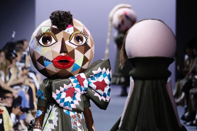 While couture fashion week is a chance to indulge in spectacle, Viktor & Rolf (a long-standing guest member of couture week) continue to challenge the more sedate status quo. In their show this week models walked down the runway wearing large doll's masks, paired with Doc Martens.