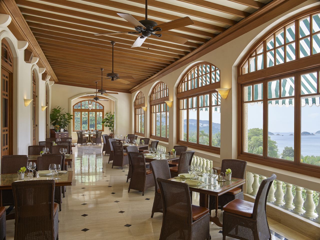 <strong>Ocean views:</strong> The Verandah, which overlooks the South China Sea, offers a colonial-era atmosphere and live piano music.