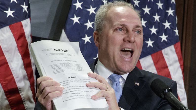 While speaking on Capitol Hill in March, Scalise holds up what he said was his original copy of Obamacare. He has been working with Republicans to repeal the health-care bill.