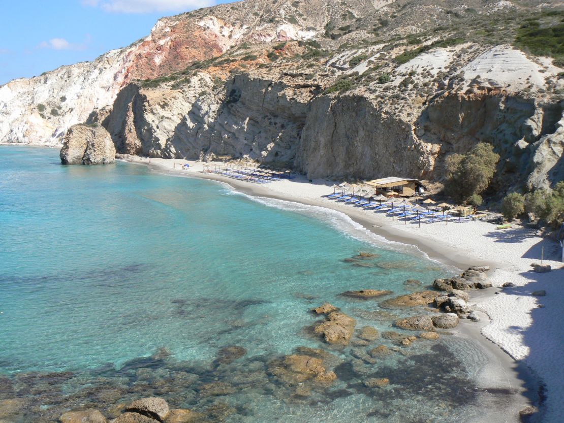 Firiplaka lies beneath steep, coffee-colored cliffs.