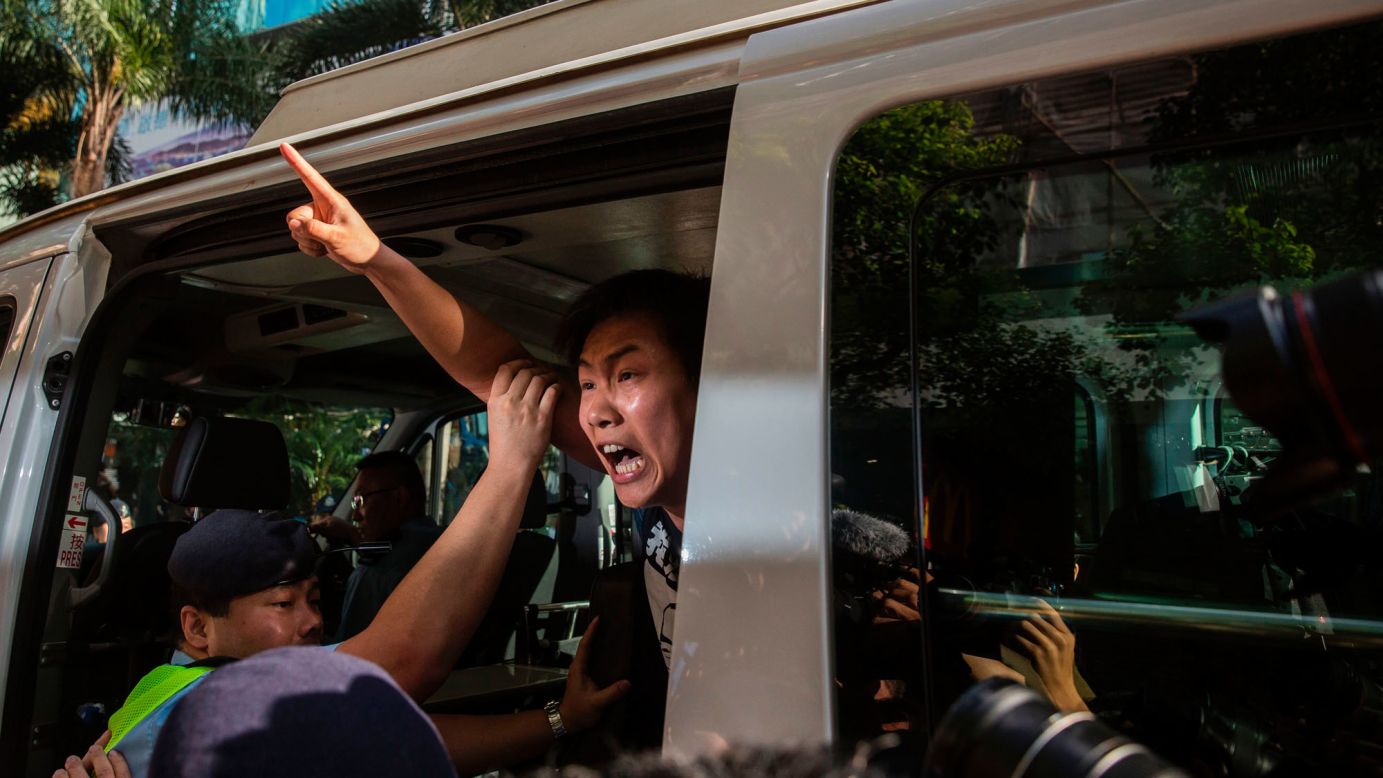 Protester Raphael Wong is taken away by police during a demonstration in Hong Kong on Saturday, July 1. A flag-raising ceremony was taking place in the city to mark 20 years of Chinese rule. Chinese President Xi Jinping <a href="http://www.cnn.com/2017/06/30/asia/hong-kong-china-handover/index.html" target="_blank">made his first visit to Hong Kong</a> since he took power in Beijing in 2013, but he left before the start of the city's annual pro-democracy march.