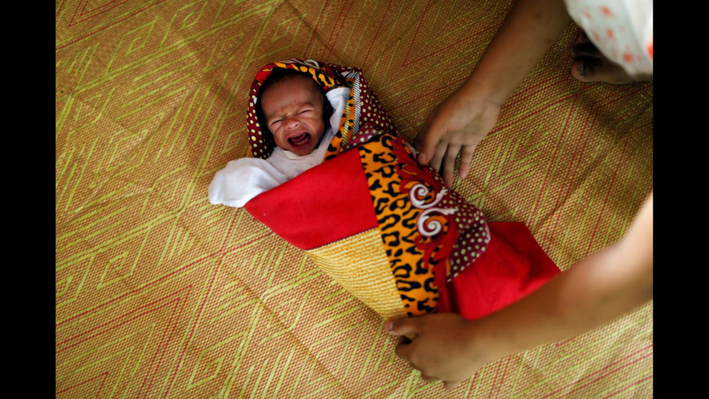Esmayatin Lomantong, just 10 days old, is cared for by his mother at an evacuation center outside Marawi, Philippines, on Monday, July 3. Esmayatin was born at the evacuation center. Marawi <a href="http://www.cnn.com/2017/07/05/asia/marawi-philippines-isis-satellite-imagery/index.html" target="_blank">has been under siege for six weeks</a> as government forces try to push ISIS militants out of the area.