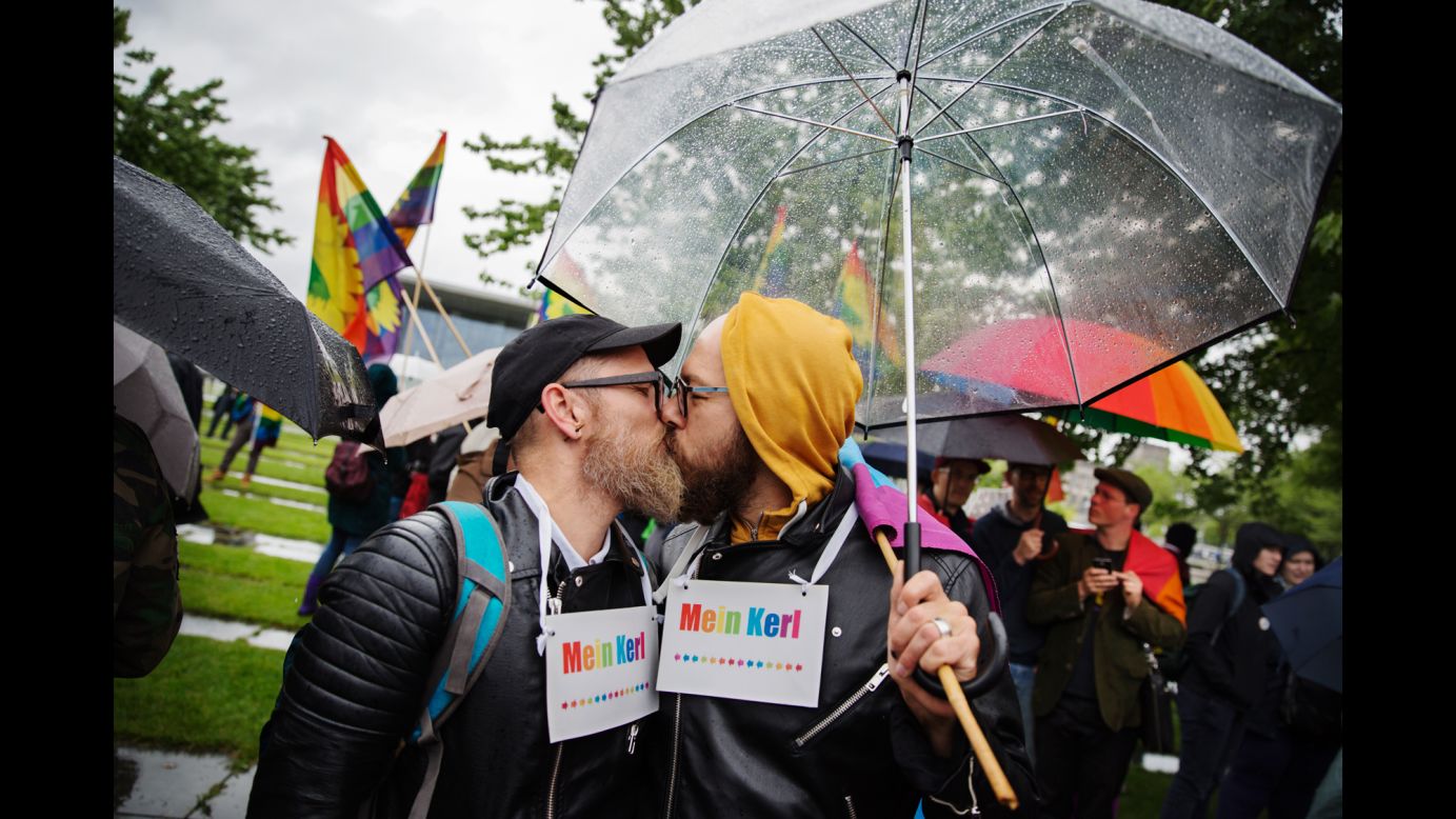 Heiko Mersch, left, kisses Sebastian Oppermann outside the Chancellary in Berlin after German lawmakers <a href="http://www.cnn.com/interactive/2017/06/world/germany-same-sex-marriage-cnnphotos/index.html" target="_blank">voted to legalize same-sex marriage</a> on Friday, June 30. 