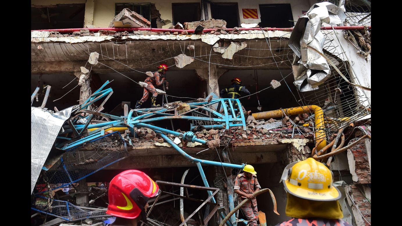 Firefighters take part in a search-and-rescue operation after a boiler explosion destroyed a garment factory in Gazipur, Bangladesh, on  Monday, July 3.