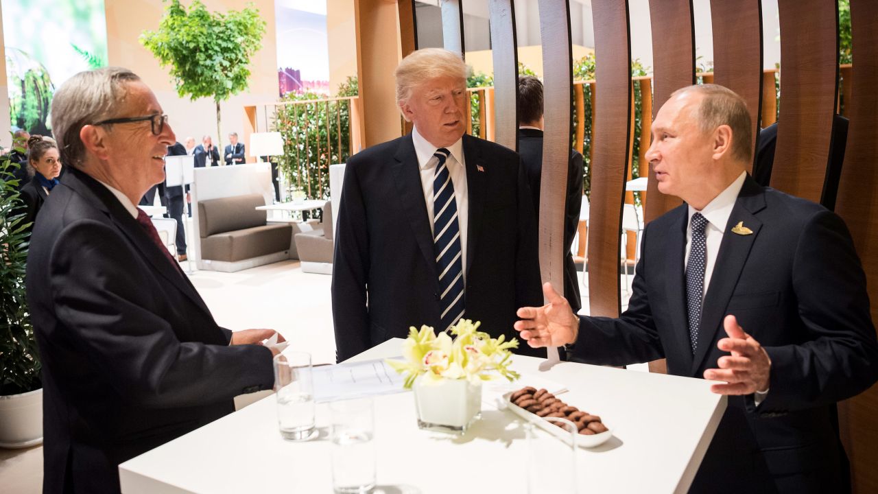 Trump stands with Putin and European Commission President Jean-Claude Juncker, left, at the G20 summit. Climate change, terrorism and migration are on the agenda.