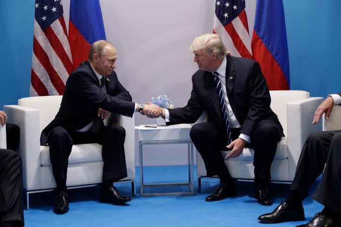 Trump shakes hands with Putin as <a href="index.php?page=&url=http%3A%2F%2Fwww.cnn.com%2F2017%2F07%2F07%2Fpolitics%2Ftrump-putin-meeting%2Findex.html" target="_blank">they meet on the sidelines</a> of the summit. They talked for more than two hours, discussing interference in US elections and ending with an agreement on curbing violence in Syria.