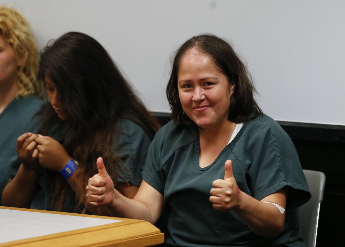 Isabel Martinez gives a thumbs-up to cameras as she appears in court  Friday in Lawrenceville, Georgia.