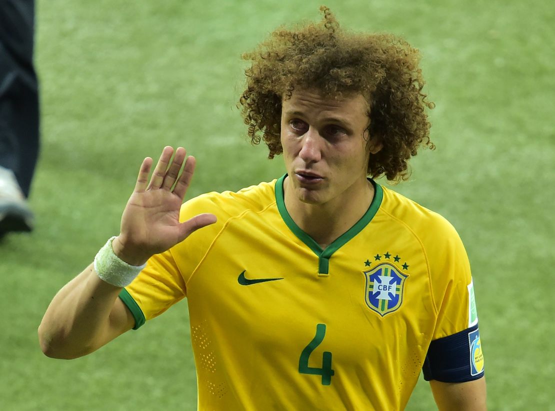 David Luiz leaves the field in tears. The defender was heavily criticized for his role in the defeat.