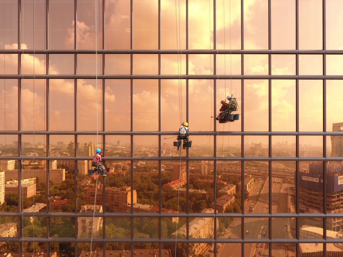 This spectacular image depicts window cleaners scrubbing Moscow's Mercury Tower.