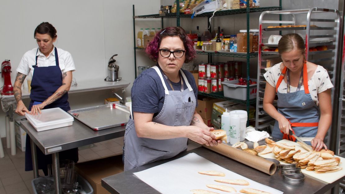 Chef Rebecca Masson, center, and her assistant from Fluff Bake Bar work alongside Chef Whitney Otawka, left. 