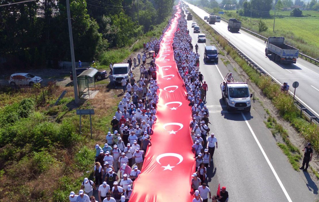 Thousands of supporters hold a one-kilometer stream of Turkish flags in Sakarya on July 1 during the march.