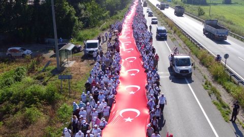 Thousands of supporters hold a one-kilometer stream of Turkish flags in Sakarya on July 1 during the march.