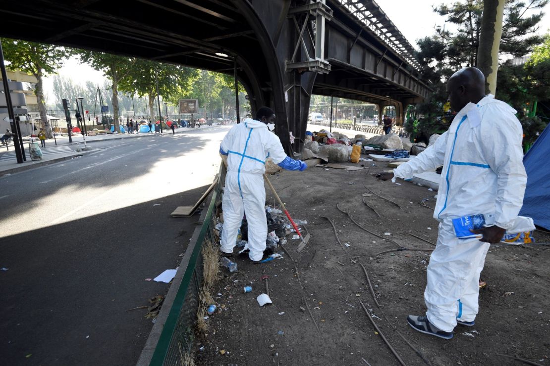 Workers clear the site in Porte de la Chapelle.