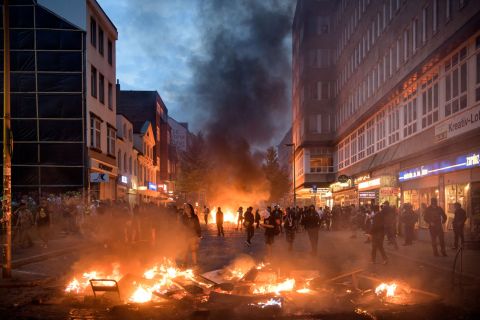 Protesters gather near a burning barrier during a demonstration against the G20 summit on Friday, July 7, in Hamburg, Germany. Protesters clashed with authorities as world leaders gathered for the two-day economic summit. 