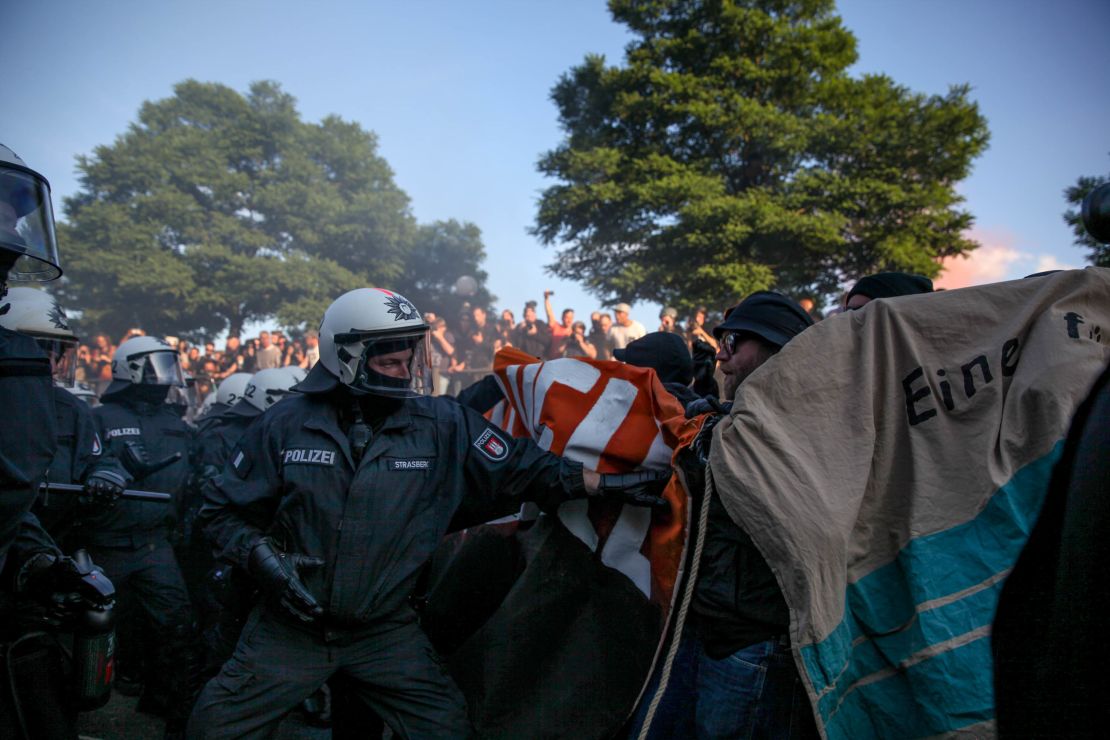 Riot police and demonstrators clash during the "Welcome to Hell" rally last Thursday.
