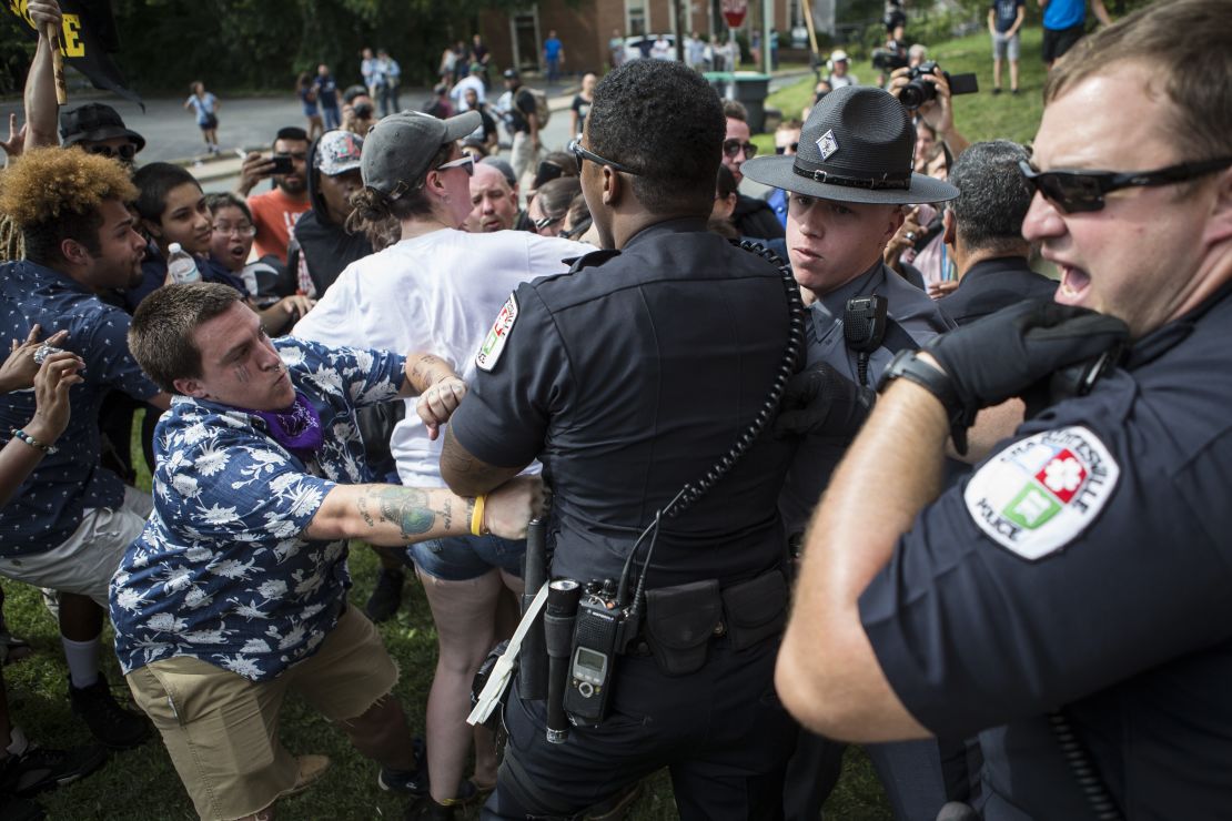 Officers clash with counter protestors who turned out in reaction to a KKK rally.