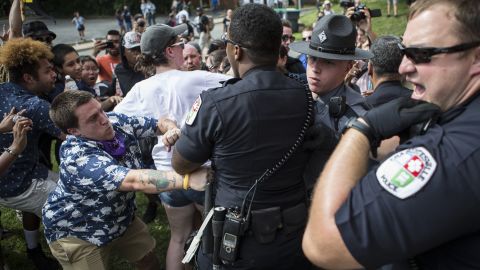 Officers clash with counter protestors who turned out in reaction to a KKK rally.