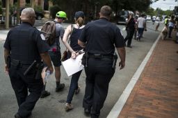 A counter protestor is arrested Saturday in Charlottesville.