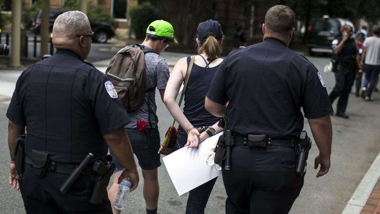 A counter protestor is arrested Saturday in Charlottesville.