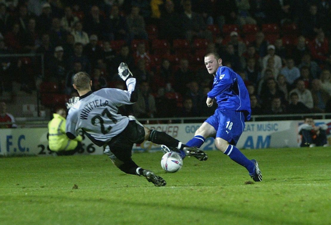 Rooney scoring for Everton as a teenager in 2002.