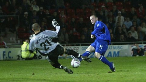 Rooney scoring for Everton as a teenager in 2002.