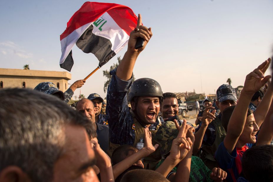 Members of the Iraqi federal police wave the country's flag as they celebrate in the Old City of Mosul on July 9, 2017. <a href="http://www.cnn.com/2017/07/09/middleeast/iraq-mosul-victory-claimed/index.html" target="_blank">Iraq declared victory against ISIS forces in Mosul </a>after a grueling monthslong campaign. The battle to reclaim Mosul, the last major ISIS stronghold in Iraq, has been underway since fall 2016.