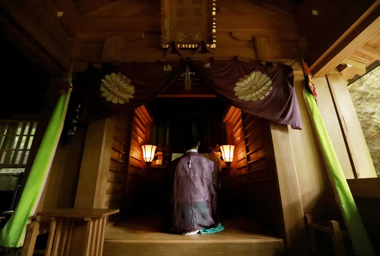 A Shinto priest holds a ritural ceremony at Okitsugu shrine of the Munakata Taisha in Okinoshima island.