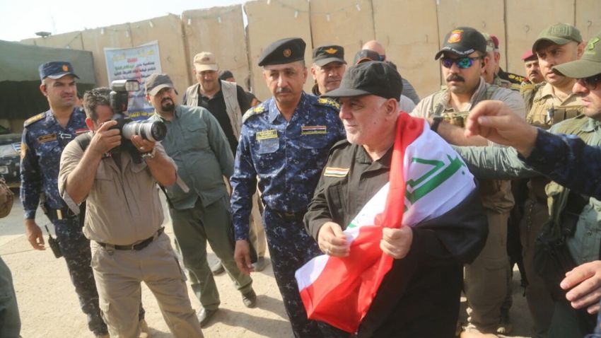 Various of Iraqi Prime Minister Haidar al-Abadi visiting the governor of Mosul and walking through eastern Mosul streets and meeting residents.