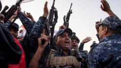 Members of the Iraqi federal police forces celebrate in the Old City of Mosul on July 10, 2017 after the government's announcement of the "liberation" of the embattled city from Islamic State (IS) group fighters.
Iraqi Prime Minister Haider al-Abadi's office said he was in "liberated" Mosul to congratulate "the heroic fighters and the Iraqi people on the achievement of the major victory".