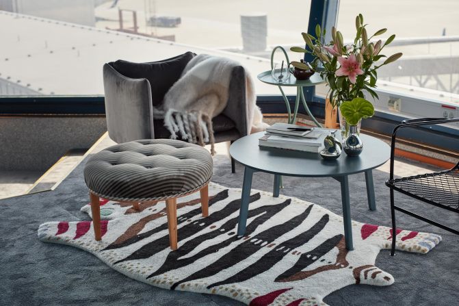 <strong>Blue skies: </strong>Living the high life: Ramnek has designed a 1960s gray-scale color scheme. The chic design is complemented by pops of color and blue skies glimpsed through the floor to ceiling windows.