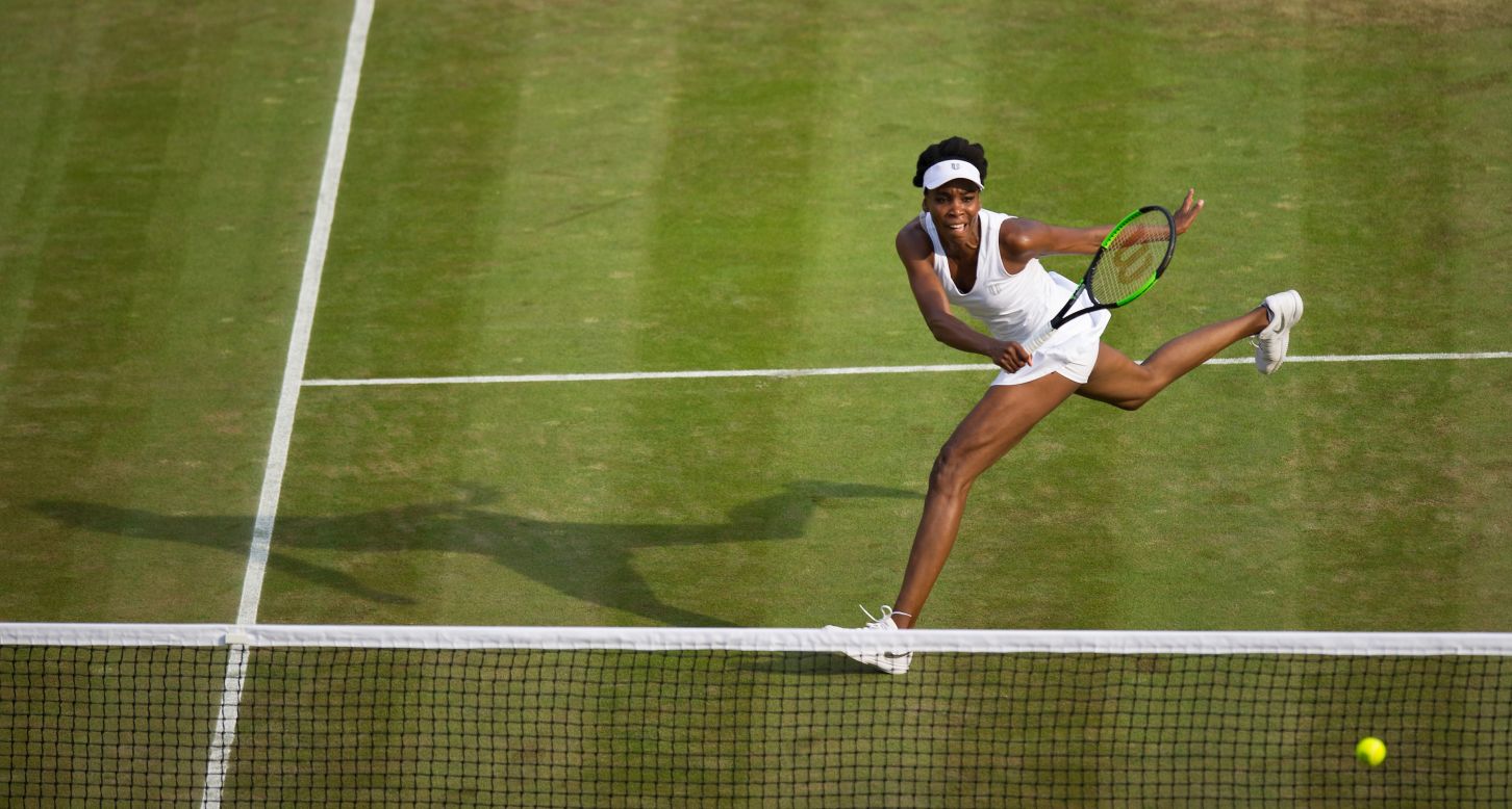 Venus Williams hits a shot during her third-round match at Wimbledon on Friday, July 7. She defeated Naomi Osaka 7-6, 6-4.