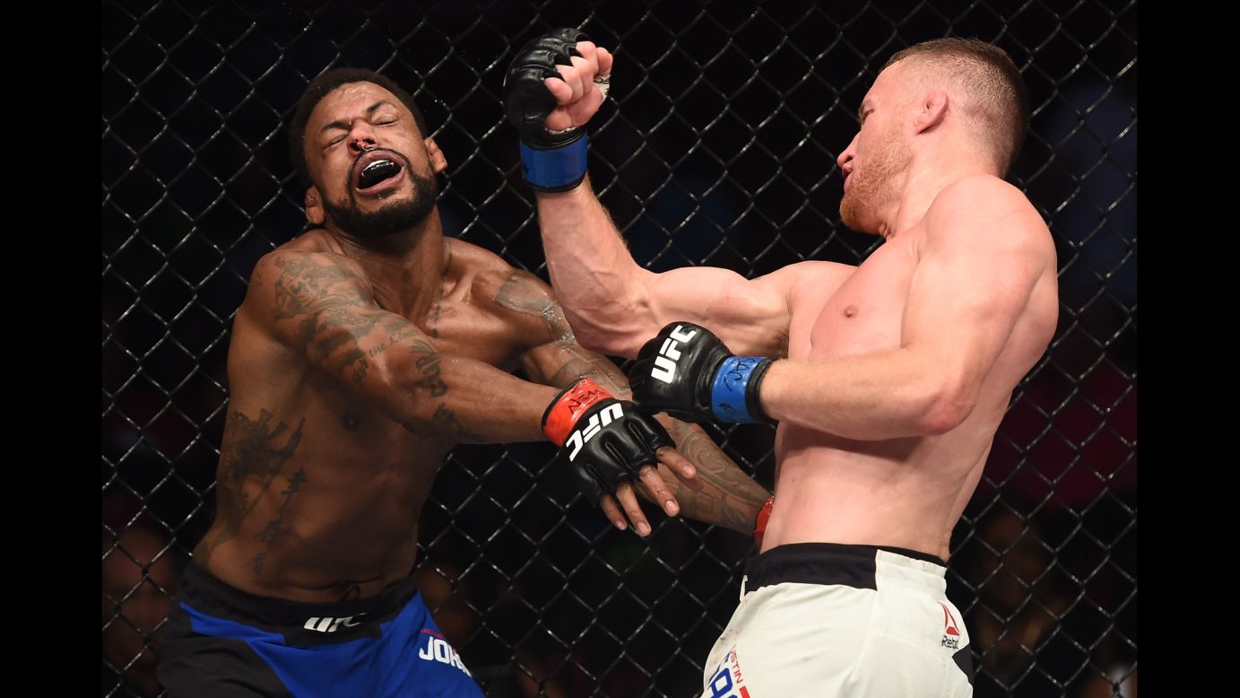 UFC fighter Justin Gaethje punches Michael Johnson during their lightweight bout in Las Vegas on Friday, July 7. Gaethje stopped Johnson late in the second round.