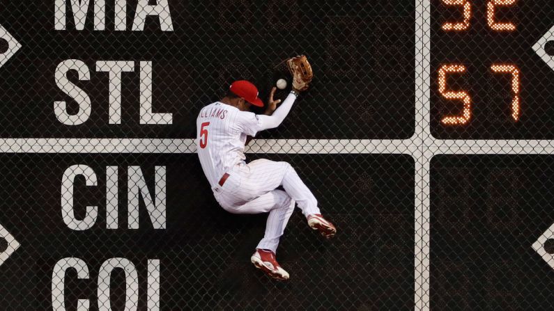 Philadelphia left fielder Nick Williams crashes into the wall as he tries to make a catch against Pittsburgh on Wednesday, July 5.