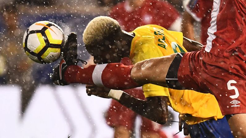 Canada's Dejan Jakovic, in red, competes for the ball with French Guiana's Arnold Abelinti during a Gold Cup match in Harrison, New Jersey, on Friday, July 7.