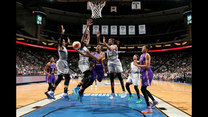 Los Angeles' Chelsea Gray is surrounded by Minnesota Lynx as she attempts a layup during a WNBA game on Thursday, July 6.