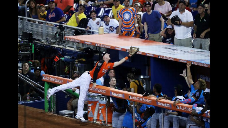 Colorado's Ryan McMahon, representing the US team, catches a foul ball during Major League Baseball's All-Star Futures Game on Sunday, July 9.