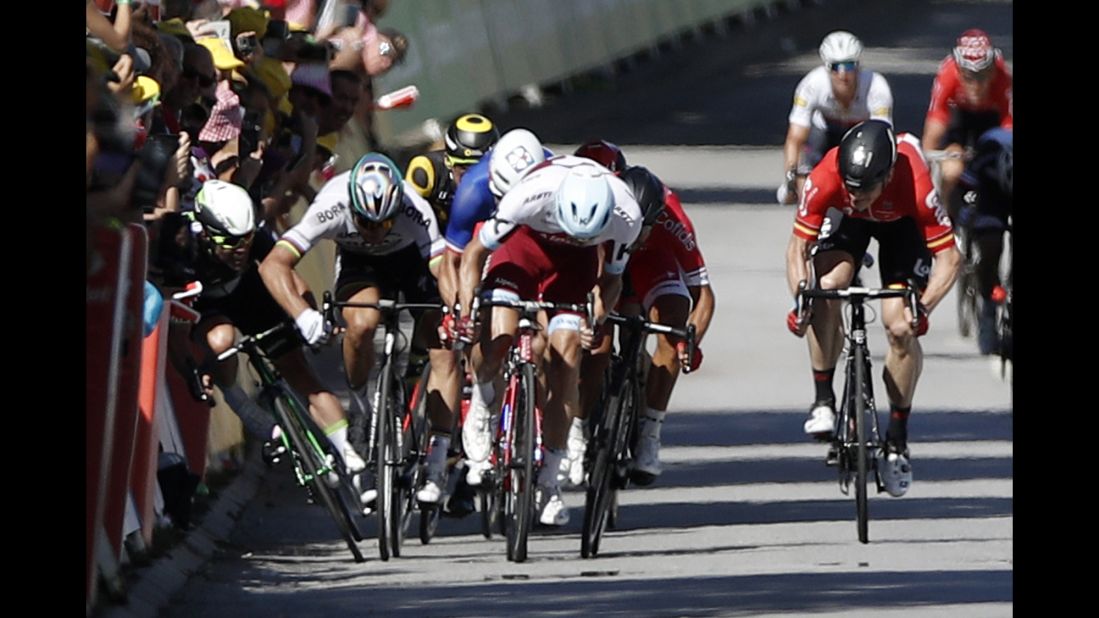 Peter Sagan (2-L) of Slovakia flicks his elbow towards Team Dimension Data rider Mark Cavendish (L) during the final sprint of the fourth stage. Sagan was subsequently disqualified from the Tour, before making an unsuccessful appeal to CAS. Cavendish suffered an injured shoulder which ended his hopes of overtaking Eddy Merckx as the Tour's most prolific stage winner.