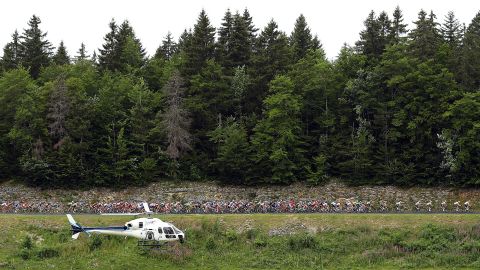 The peloton rides past an emergency helicopter during stage nine.