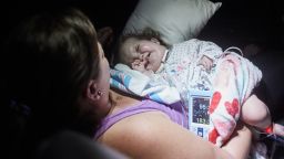 Chasely Diez, 13 months, is treated for a high fever during an overnight bus trip from Baton Rogue to Washington DC on Sunday, July 9, 2017 in Raleigh, NC. The fever caused her to have high blood pressure and her mother, Aimee and others aboard the charter bus managed to get the fever under control and her blood pressure down. Charley was born with an undiagnosed genetic syndrome and wears a tracheostomy tube to breathe.   Photo by John Nowak/CNN