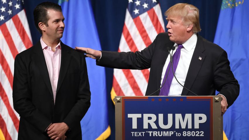 LAS VEGAS, NV - FEBRUARY 23:  Donald Trump Jr. (L) looks on as his father, Republican presidential candidate Donald Trump, speaks at a caucus night watch party at the Treasure Island Hotel & Casino on February 23, 2016 in Las Vegas, Nevada. The New York businessman won his third state victory in a row in the "first in the West" caucuses.  (Photo by Ethan Miller/Getty Images)