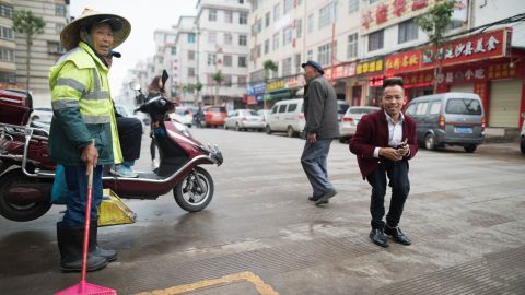 Huang Xuejing, in the red jacket, used to work in the kingdom as a manager but left six years ago to work as a freelance performer in Kunming.