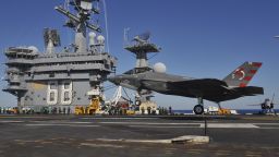 An F/A-18E Super Hornet prepares for takeoff from the flight deck of the USS Nimitz (CVN 68) aircraft carrier.
