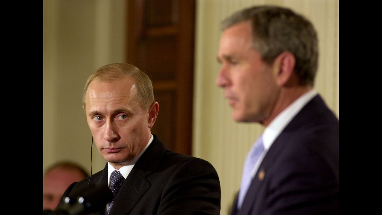 Putin listens to US President George W. Bush during a visit to the White House in November 2001. A few months later, the two signed a treaty to reduce and limit their strategic nuclear warheads.