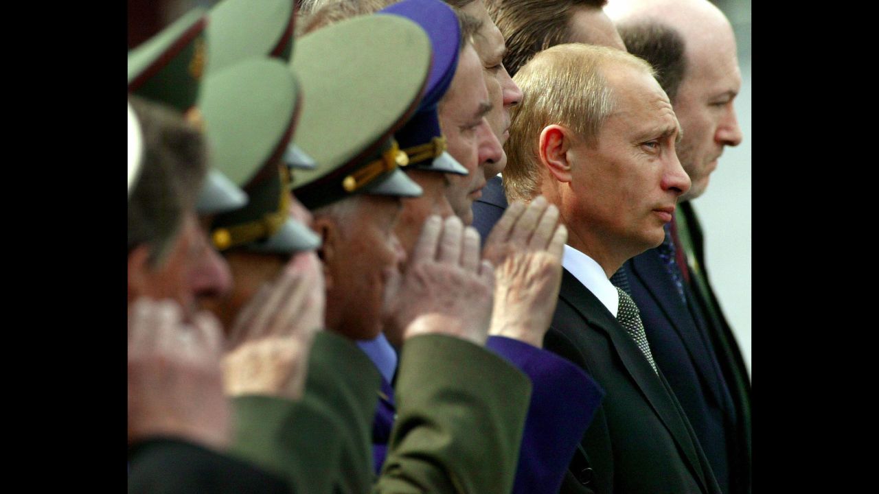 Putin watches honor guards march at the Tomb of the Unknown Soldier during a wreath-laying ceremony in Moscow in June 2003.