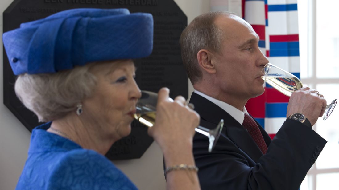Putin and Dutch Queen Beatrix share a toast after unveiling a plaque at the Hermitage Amsterdam museum in April 2013. It's a branch of the Hermitage Museum in St. Petersburg.