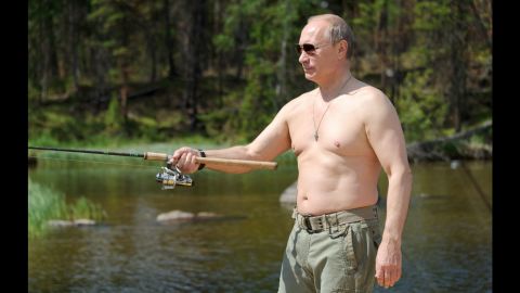 Putin fishes in Russia's Tuva region during a vacation in July 2013. For years, Putin has cultivated a populist image in the Russian media.