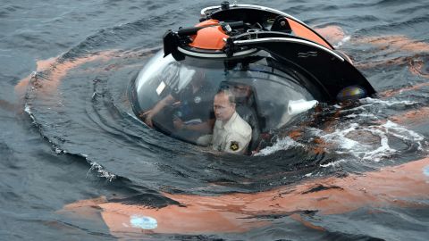 Putin sits in a bathyscape as it plunges into the Black Sea in August 2016. He went underwater to see the wreckage of an ancient merchant ship that was found earlier in the year.