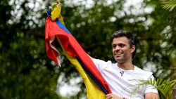Venezuelan opposition leader Leopoldo Lopez displaying a Venezuelan national flag, greets supporters gathering outside his house in Caracas, after he was released from prison and placed under house arrest for health reasons, on July 8, 2017.
Venezuela's Supreme Court confirmed on its Twitter account it had ordered Lopez to be moved to house arrest, calling it a "humanitarian measure" granted on July 7 by the court's president Maikel Moreno. "Leopoldo Lopez is at his home in Caracas with (wife) Lilian and his children," Lopez's Spanish lawyer Javier Cremades said in Madrid. "He is not yet free but under house arrest. He was released at dawn." / AFP PHOTO / Federico PARRA        (Photo credit should read FEDERICO PARRA/AFP/Getty Images)